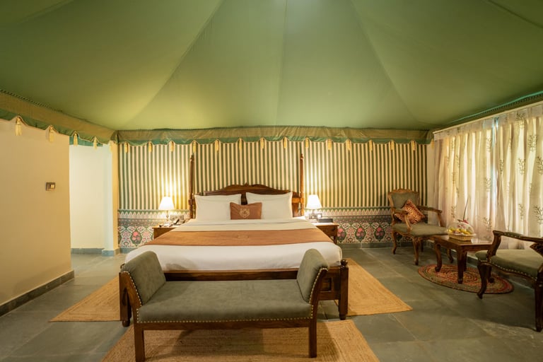 Swiss Tent — king bed beneath the canvas canopy