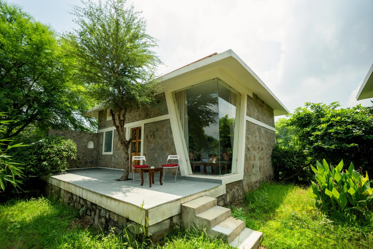 Stone Villa exterior with private patio